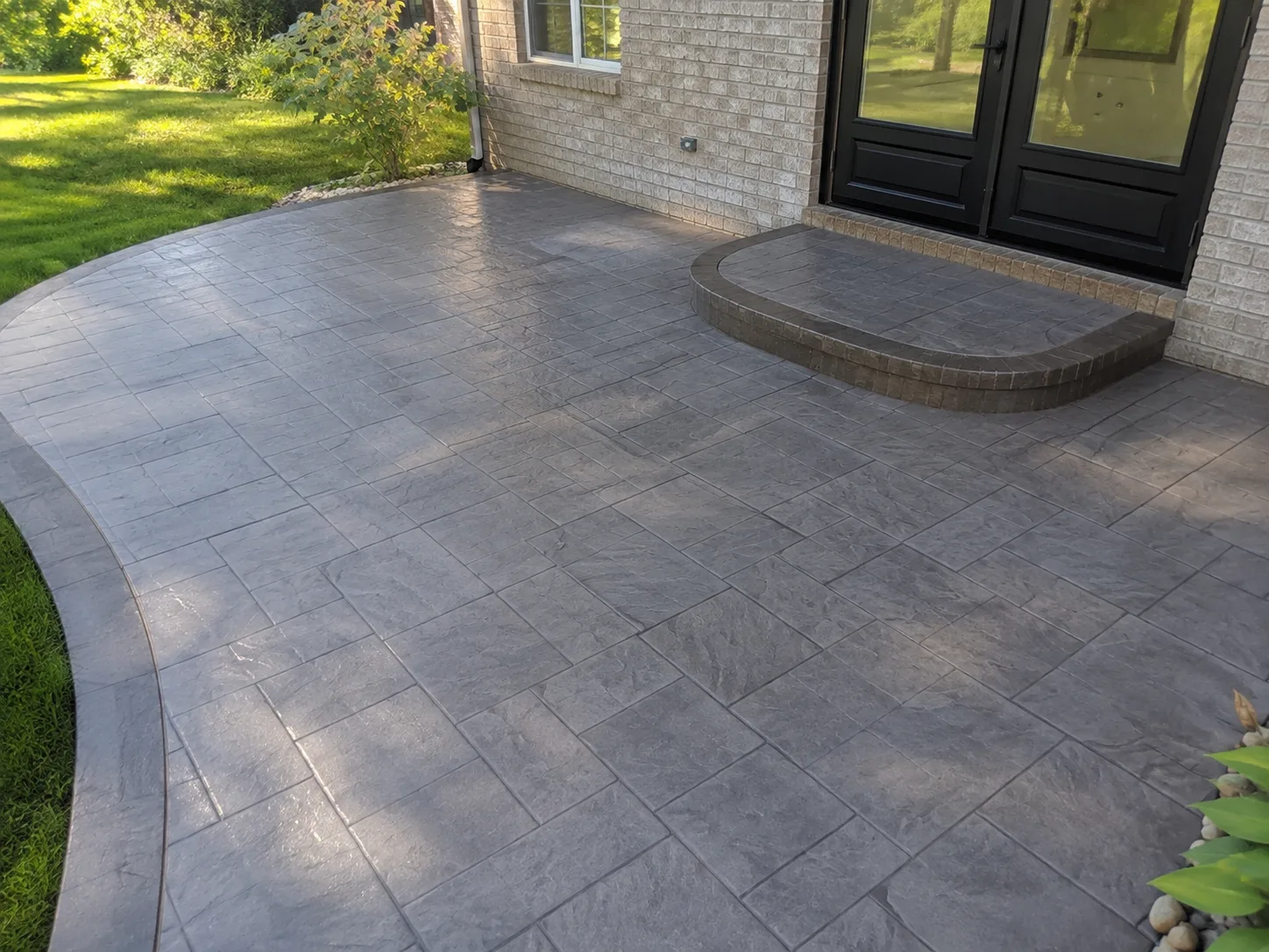 Grey stamped concrete patio installation in Forest Hills, TN